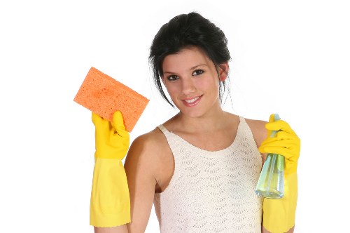 Deep cleaning a modern sofa with specialist equipment