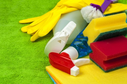 Cleaner preparing carpet cleaning equipment safely before work